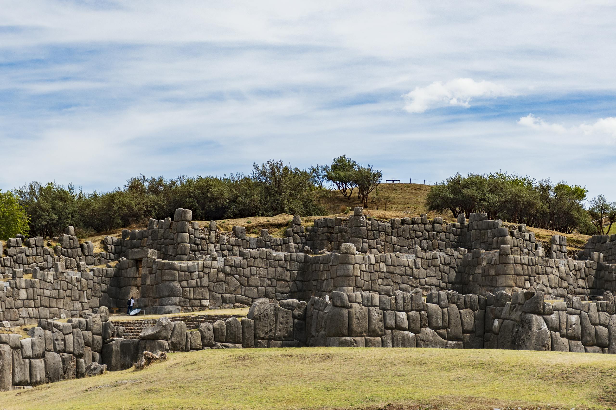 Explore the ancient Inca ruins of Sacsayhuamán in Cusco, Peru, showcasing impressive stone architecture.