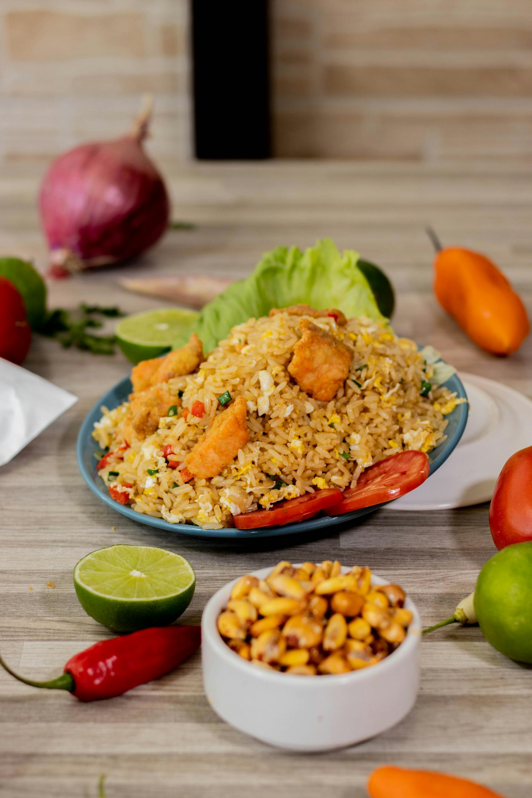 Savor this authentic Peruvian Arroz Chaufa dish featuring chicken, fresh peppers, and a touch of lime.